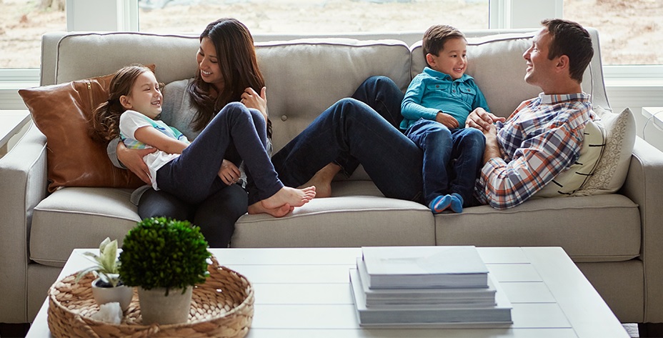 free insulation near syracuse ny image of happy family comfortable on couch at home