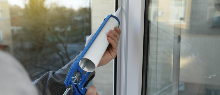 window installation near syracuse ny image of zerodraft worker sealing brand new window