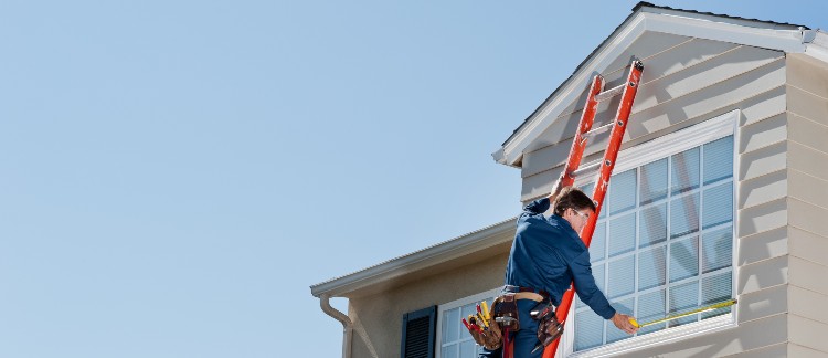 window services near syracuse ny image of zerodraft worker measuring windows