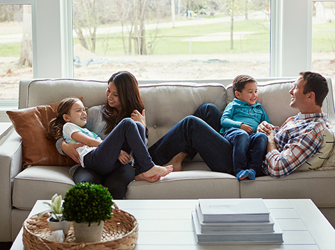 window contractors near syracuse ny family comfortable at home on couch